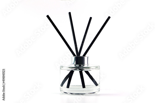 luxury aroma scent reed diffuser glass bottle is on the white table to creat romantic and relax ambient in the bedroom with white cement wall background in the morning for happy valentine day