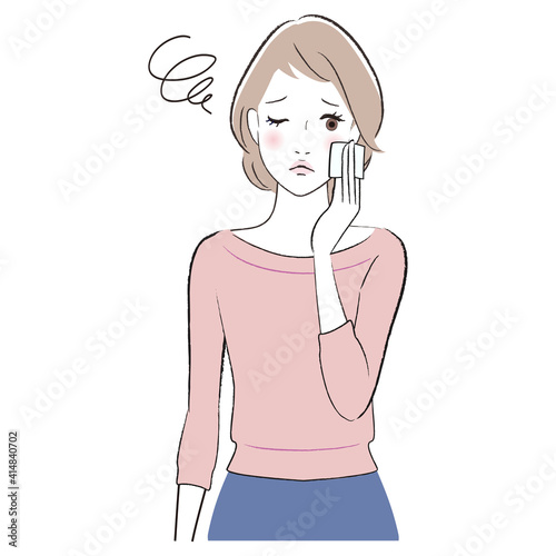 A woman feels uncomfortable while caring for her facial skin
