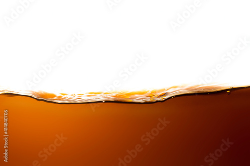 Refreshing cola water surface with separate bubbles on white.