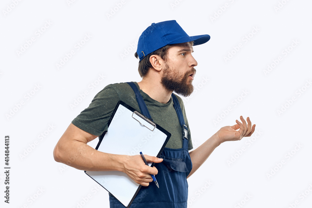 Man worker in uniform providing loading delivery service Man worker in uniform providing loading delivery service