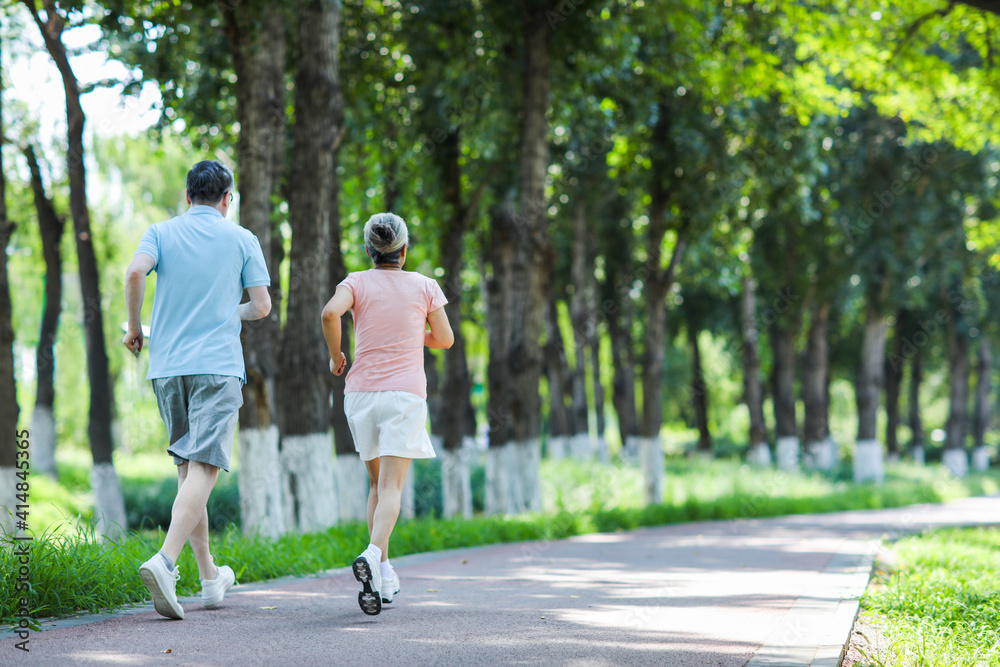 Old couple jogging in outdoor park