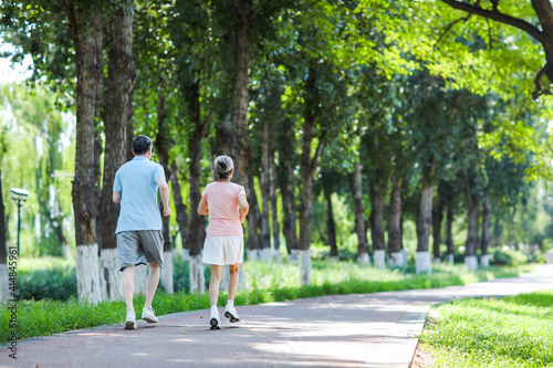 Old couple jogging in outdoor park