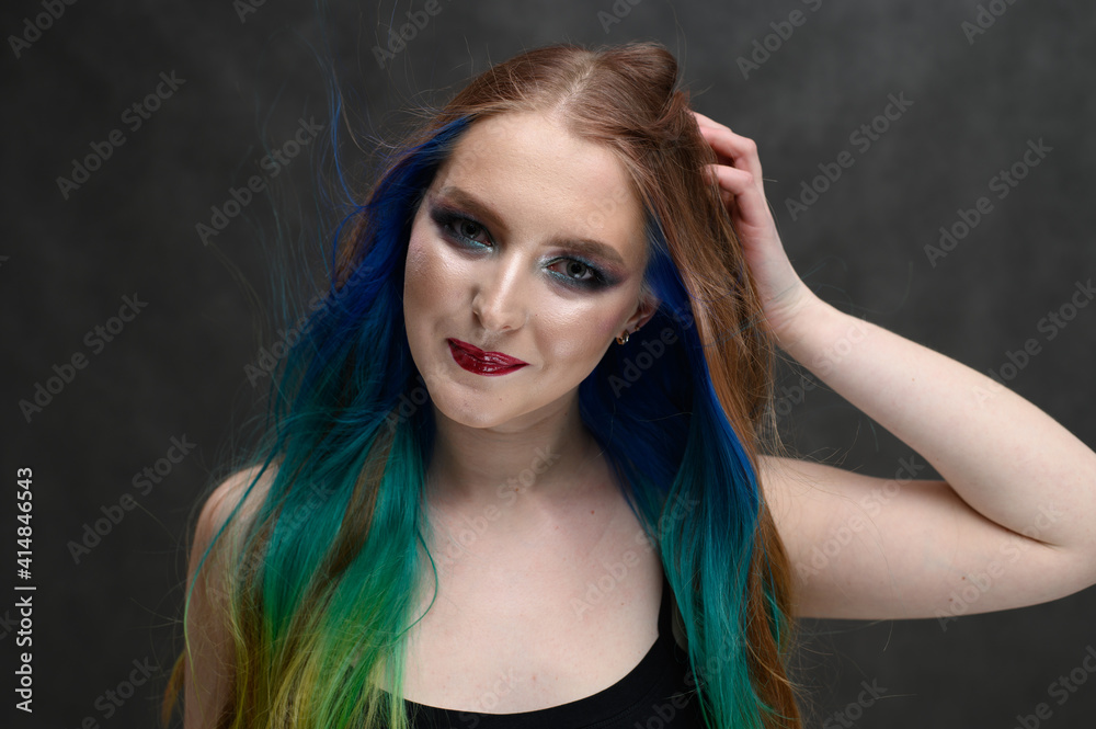 Model with perfect healthy dyed hair. Beauty fashion model girl with colorful dyed hair. Girl with perfect makeup and hairstyle.