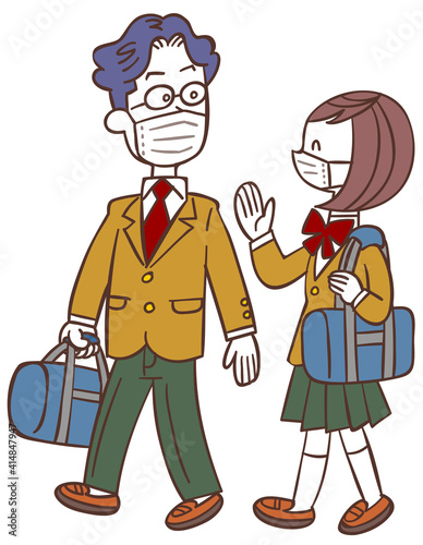 マスクをして歩いて通学する男女の学生 