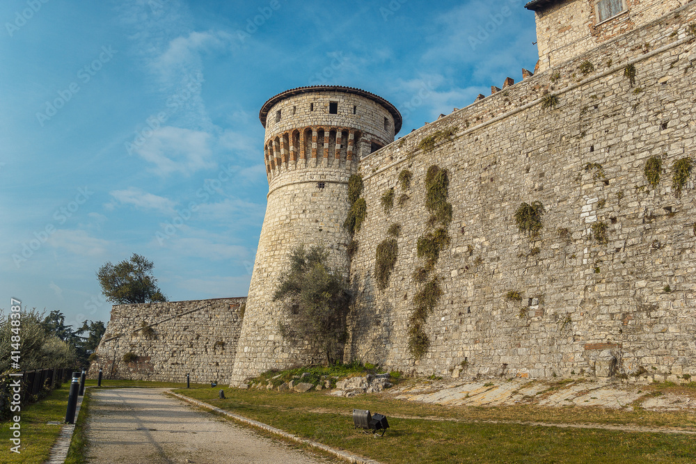 View of the Observation tower from the lower tier of the castle of Brescia city. Lombardy. The Falcon of Italy, one of the largest fortified complexes with 75,000 square metres enclosed within walls View of the Observation tower from the lower tier of the castle of Brescia city. Lombardy. The Falcon of Italy, one of the largest fortified complexes with 75,000 square metres enclosed within walls