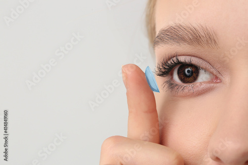 Young woman with contact le...