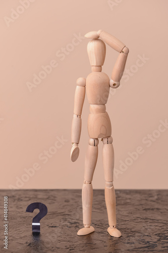 Wooden mannequin with quest...