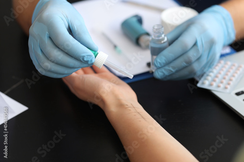 Young woman undergoing allergen skin test in clinic  closeup