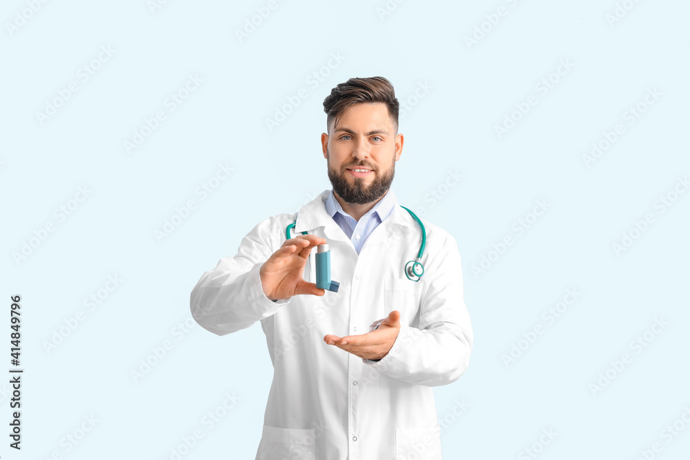 Allergist with inhaler on color background Allergist with inhaler on color background