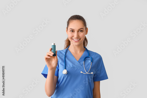 Allergist with inhaler on l...