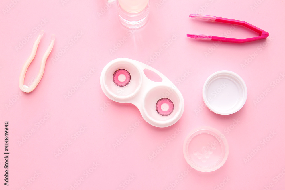 Bottle of solution, tweezers and container with contact lenses on color background Bottle of solution, tweezers and container with contact lenses on color background