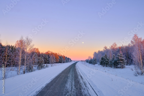 winter road in beautiful sunset