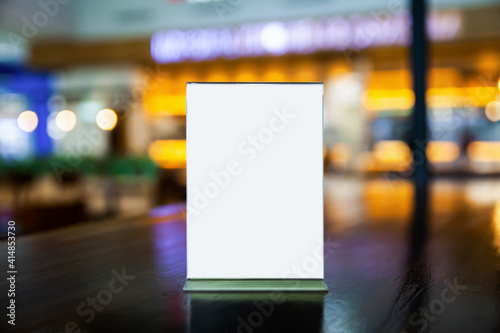 Wallpaper Mural mock up menu frame on the table in the restaurant, put texts or images in the frame, blurred bokeh background Torontodigital.ca