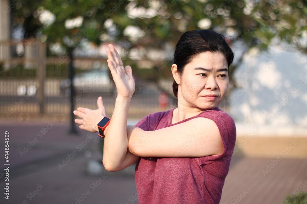 Asian woman workout before fitness and athletes training in the park. Asian woman workout before fitness and athletes training in the park.