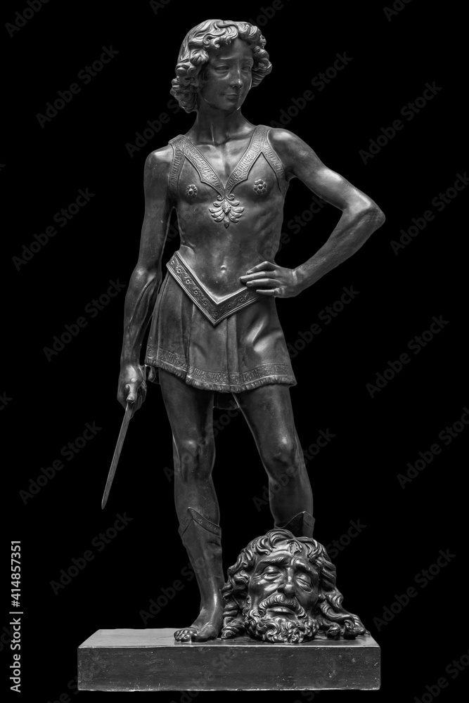 David and Goliath head ancient statue. Biblical story. Antique sculpture isolated on black background David and Goliath head ancient statue. Biblical story. Antique sculpture isolated on black background
