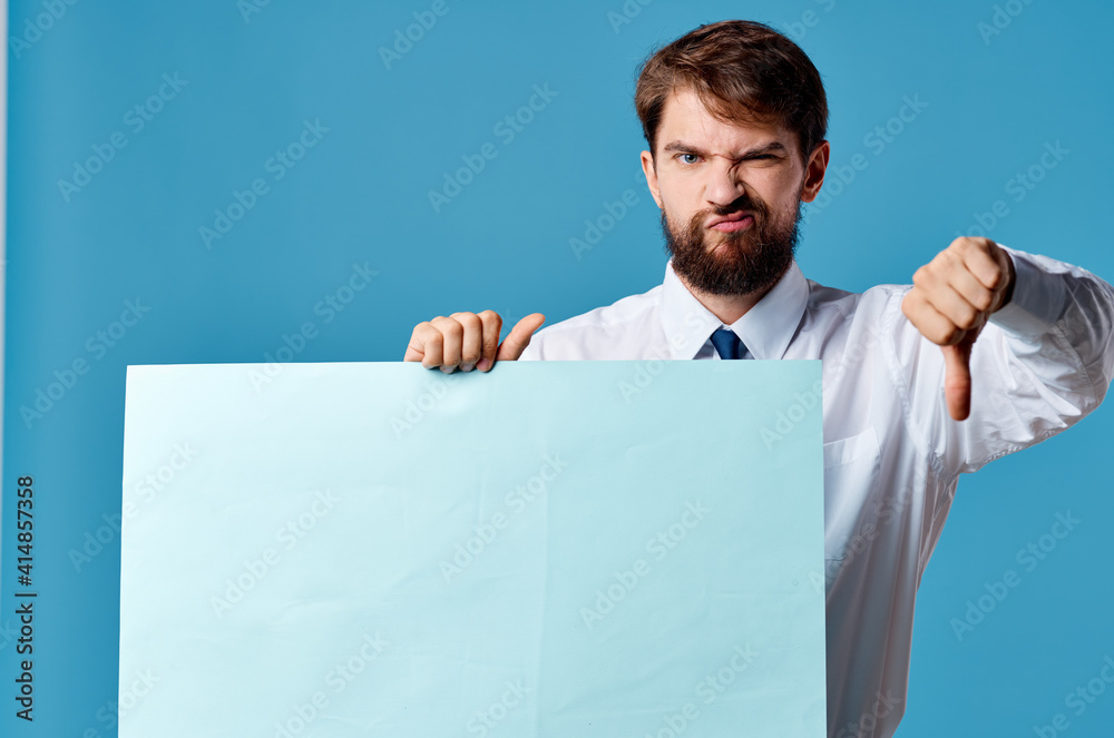 man in white shirt holding banner in hands emotions marketing blue background man in white shirt holding banner in hands emotions marketing blue background