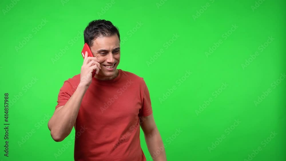Happy man talking on the mobile. Chroma green background. Happy man talking on the mobile. Chroma green background.