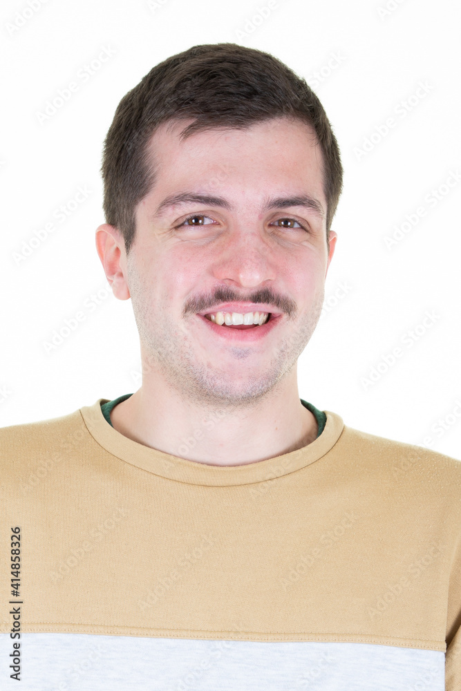 Handsome young caucasian man smiling at camera mustached boy on white background Handsome young caucasian man smiling at camera mustached boy on white background