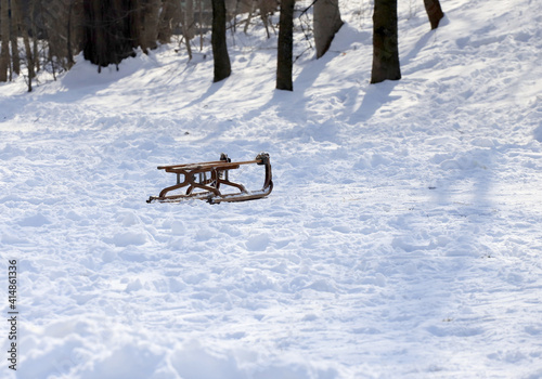 Оld wooden sled in the snow