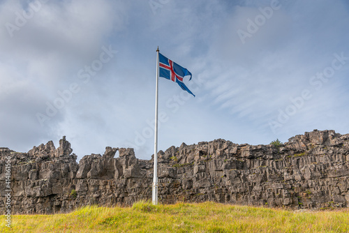 Flagpole with flag of Iceland at former Althingi site at Thingvellir national park photo