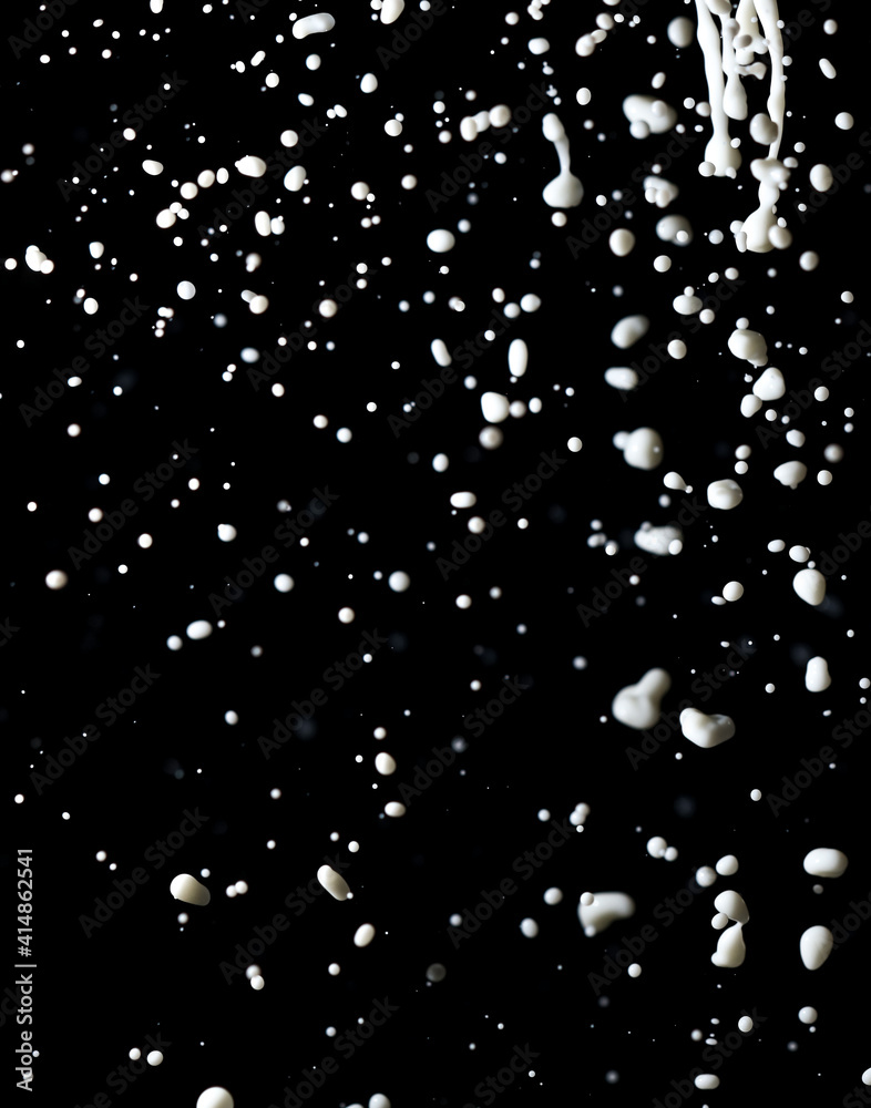 Splashes of white milk isolated on a black background. Splashes of white milk isolated on a black background.