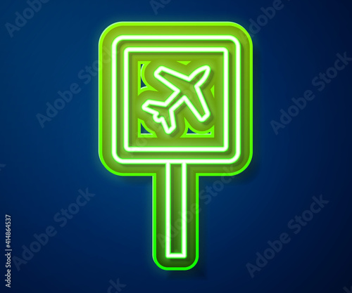 Glowing neon line Airport icon isolated on blue background. Vector.
