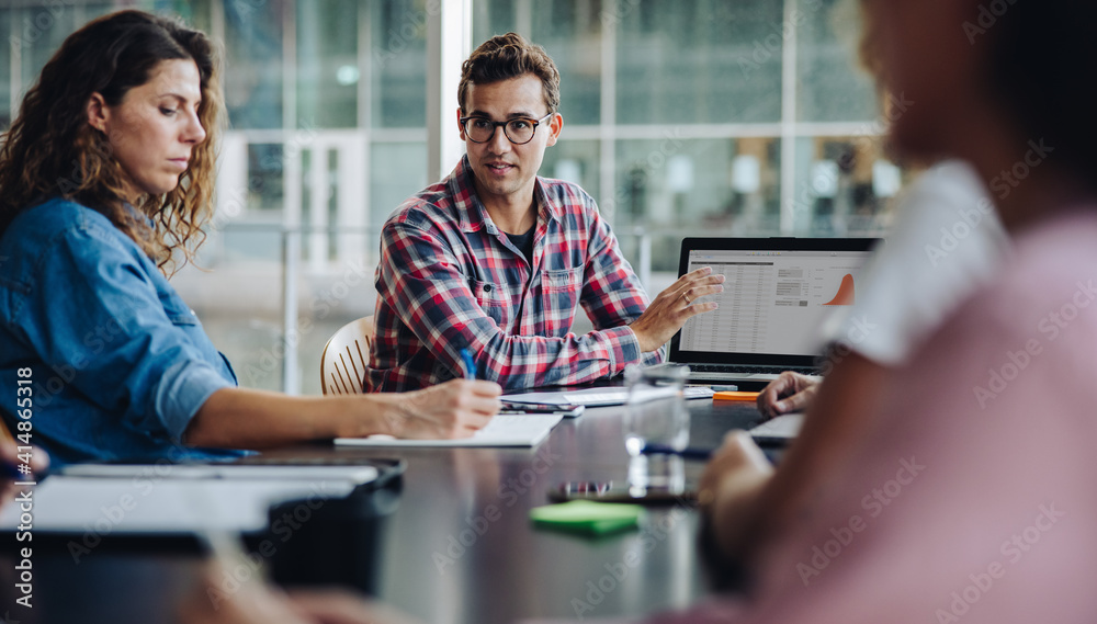 © Jacob Lund - Business professional presenting his ideas in meeting © Jacob Lund - Business professional presenting his ideas in meeting