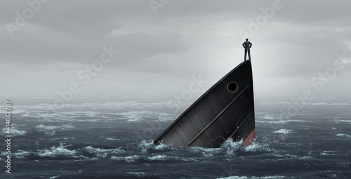 Sinking ship metaphor and failing business despair concept as a stranded businessman lost at sea as a failed corporate idea for financial crisis or being lost and needing career or financial help to e photo