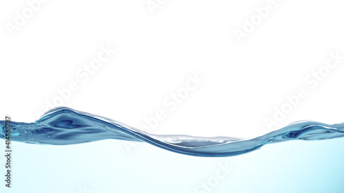 Waves of blue water on white background, close-up