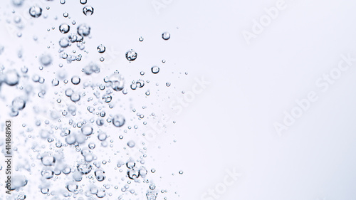 Light bubbles of water isolated over white, macro shot.