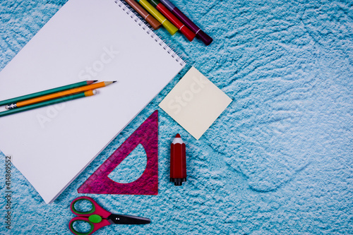 Background with notebook and school supplies.pencil, scissors, ruler