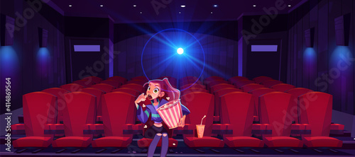 Young woman in cinema mesmerized girl with pop corn bucket in hands sitting alone in movie theater hall front of screen watching very interesting film with open mouth. Cartoon vector illustration