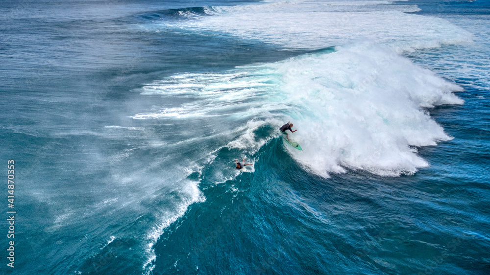 Fototapeta premium Surfer on the Lip of a Large Wave at Sunset Beach, Hawaii