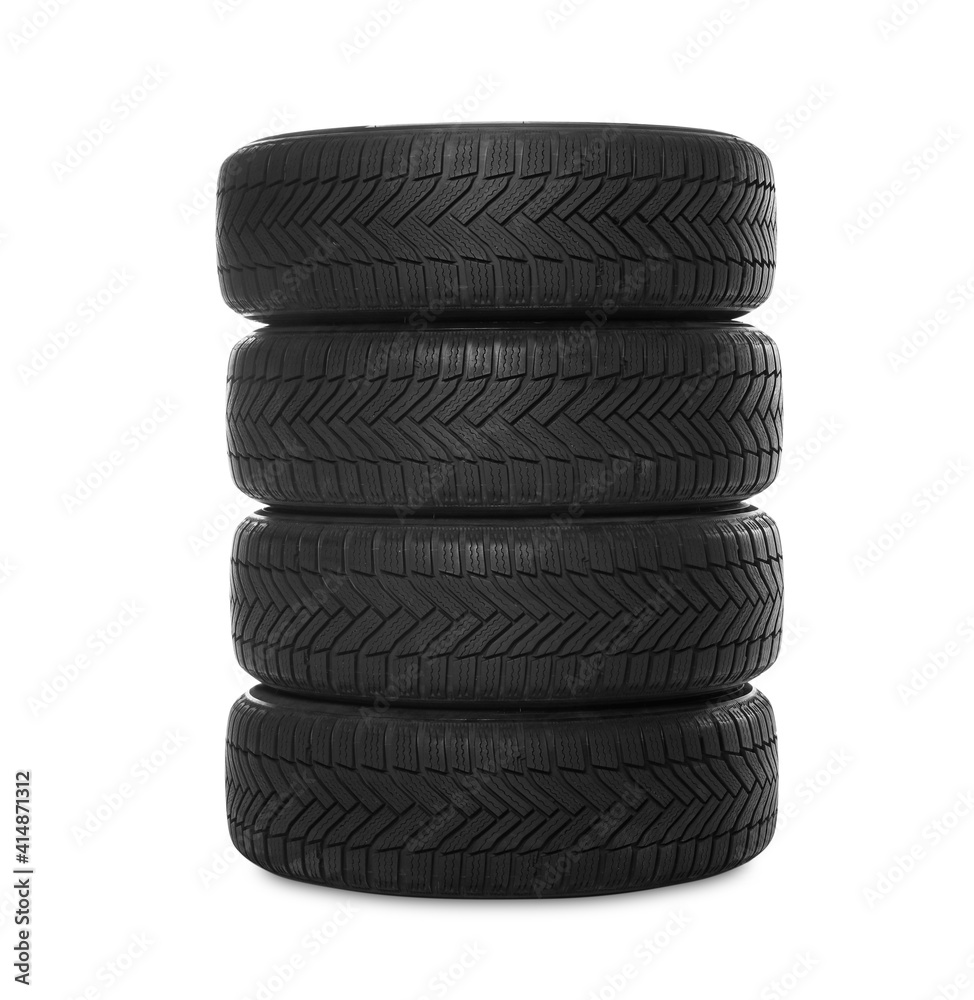 Set of new winter tires on white background Set of new winter tires on white background