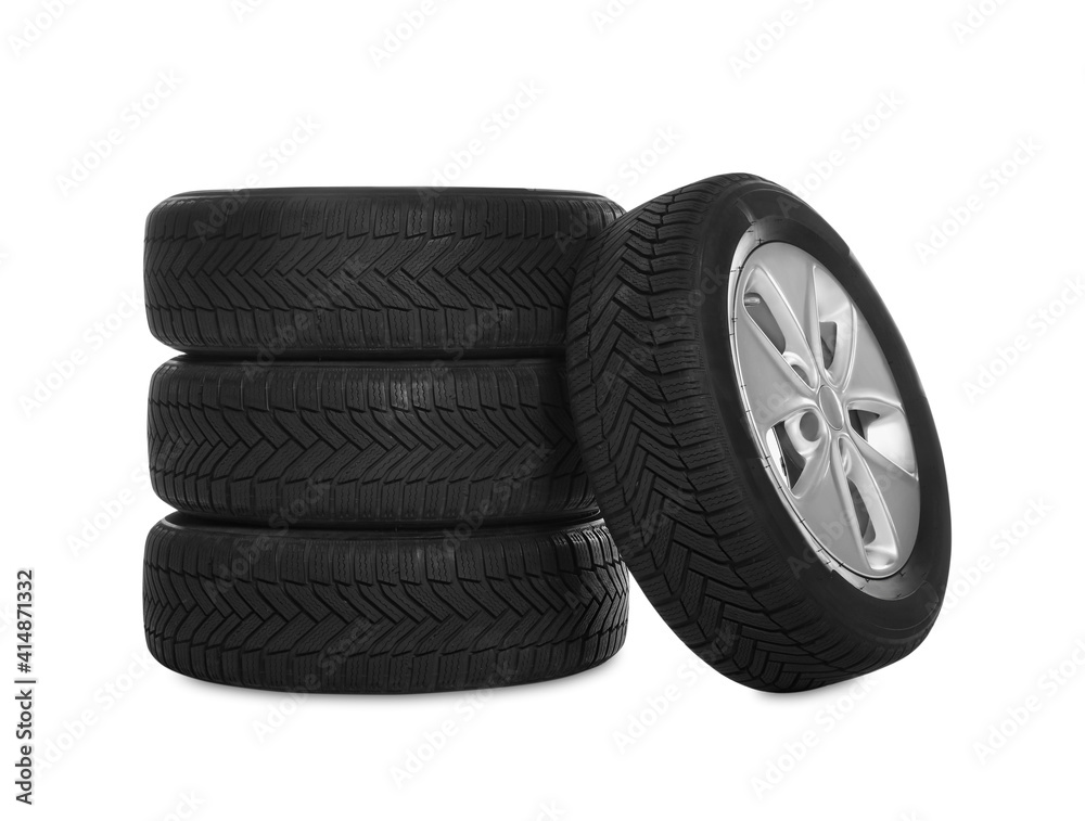 Set of wheels with winter tires on white background