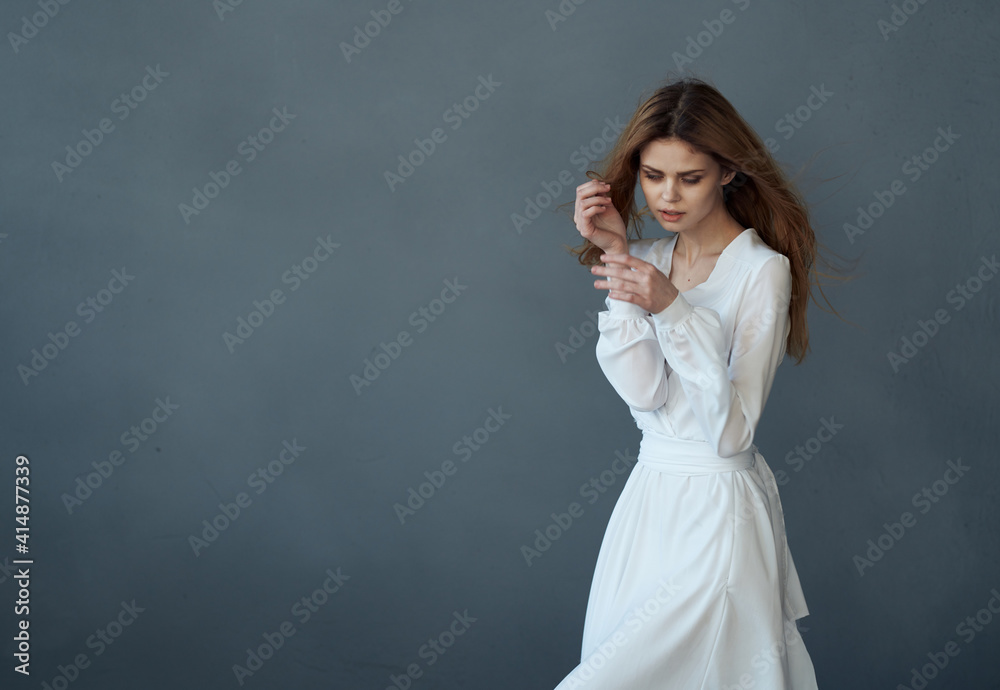 Beautiful woman in white dress glamor and luxury elegant style gray background Beautiful woman in white dress glamor and luxury elegant style gray background