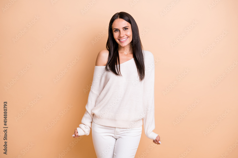 Photo of young attractive girl happy positive smile confident cute isolated over beige color background Photo of young attractive girl happy positive smile confident cute isolated over beige color background