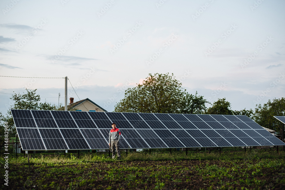 Man installing solar panels. An electrician or engineer works with solar panels. The future of alternative energy and sustainable energy. Man installing solar panels. An electrician or engineer works with solar panels. The future of alternative energy and sustainable energy.