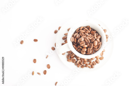 Empty cup of coffee on white background with coffee beans.