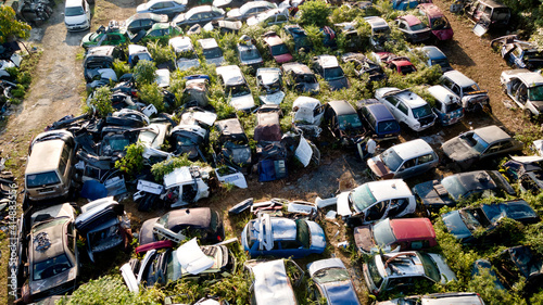 Scrapyard Aerial View. Old rusty corroded cars in car junkyard. Car recycling industry from above.