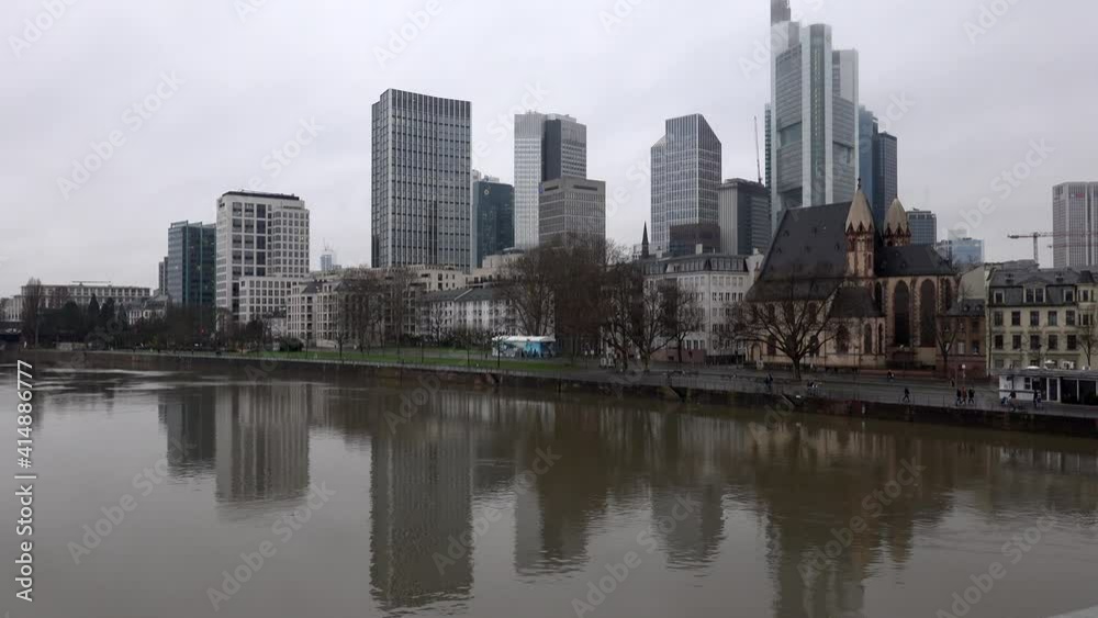 Skyline of downtown financial city center skyscrapers from opposite side of river in fog rainy day in Frankfurt-am-Main, Germany Skyline of downtown financial city center skyscrapers from opposite side of river in fog rainy day in Frankfurt-am-Main, Germany