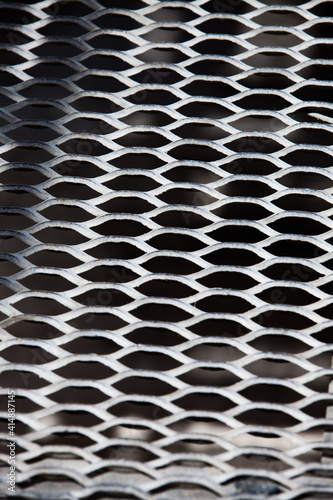 Steel grid floor on factory. Close-up of grid's pattern.
