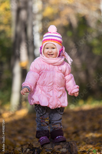 Little girl in the park. Autumn in the park