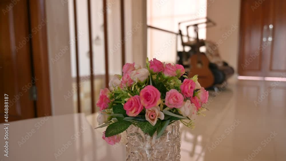 Pink and white rose bouquet on glass vase close up video with parallax camera movement and blurry background Pink and white rose bouquet on glass vase close up video with parallax camera movement and blurry background