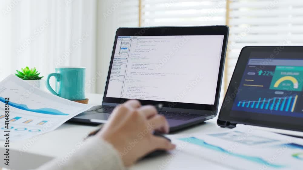 Back rear view of young asian woman, freelance data scientist work remotely at home coding programing on Big data mining, AI data engineering, IT Technician Works on Artificial Intelligence Project.