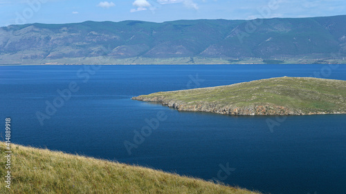 Blue lake, small green islands and hilly peninsula. Summer in nature, Europe. Earth day concept