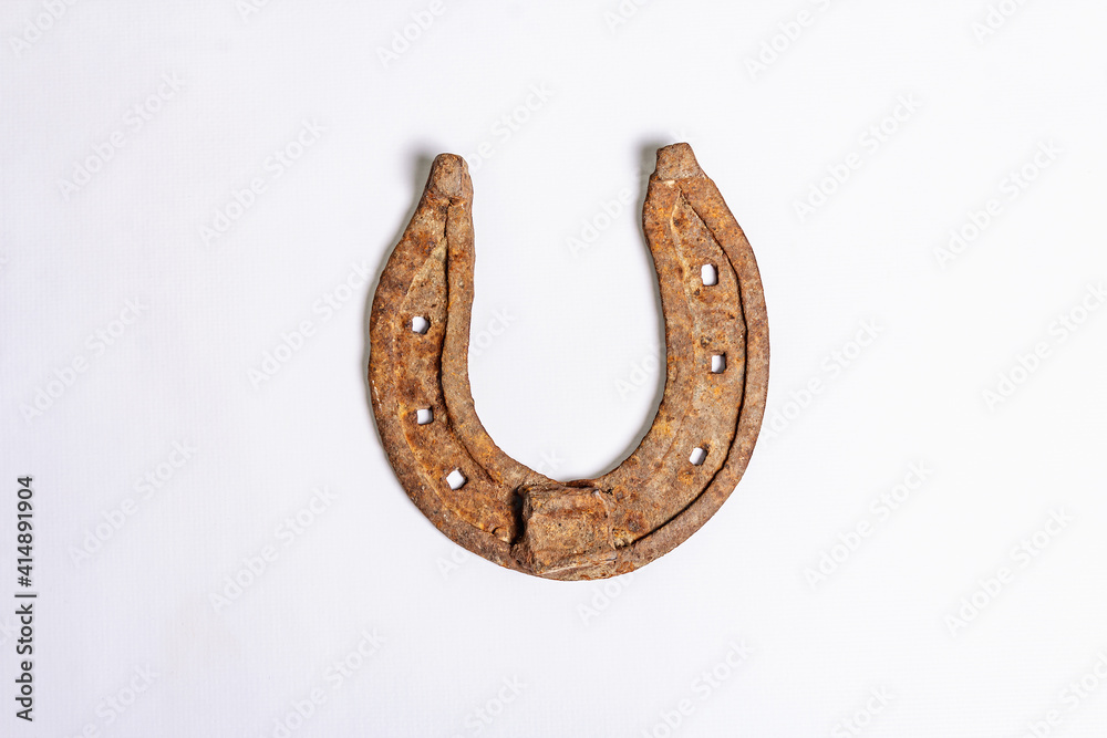 Cast iron metal horseshoes isolated on white background Cast iron metal horseshoes isolated on white background
