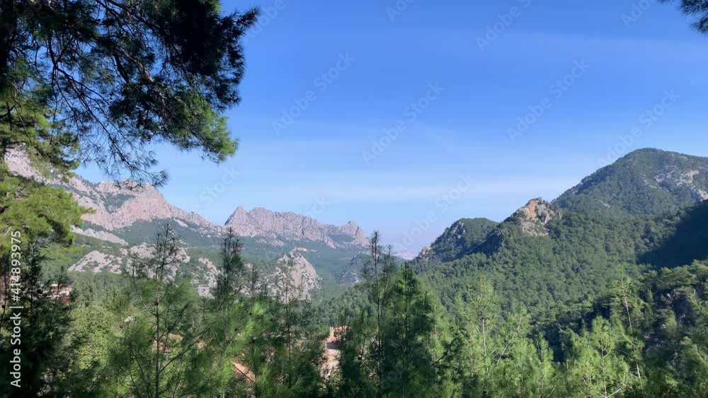 Arial view of panoramic mountains, evergreen forest, blue sky and Mediterranean Sea in Antalya Turkey. Slopes of mountains with evergreen vegetation landscape Arial view of panoramic mountains, evergreen forest, blue sky and Mediterranean Sea in Antalya Turkey. Slopes of mountains with evergreen vegetation landscape