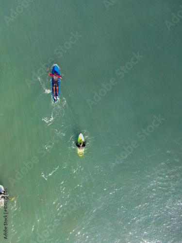 aerial view of a young man surfing 