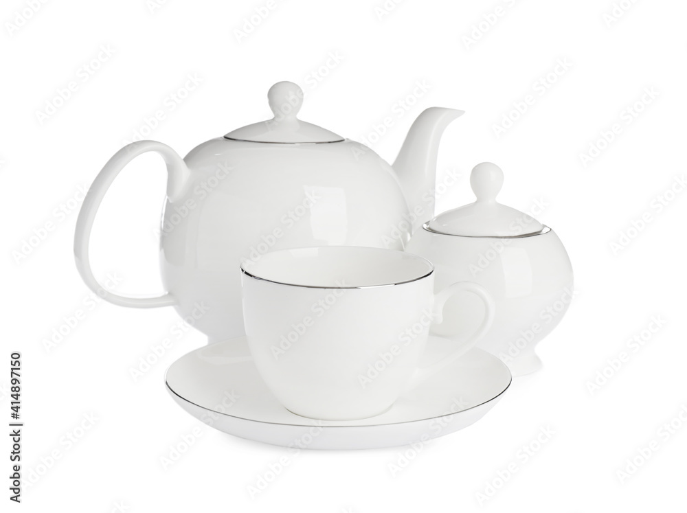 Ceramic cup with saucer, teapot and sugar bowl on white background Ceramic cup with saucer, teapot and sugar bowl on white background